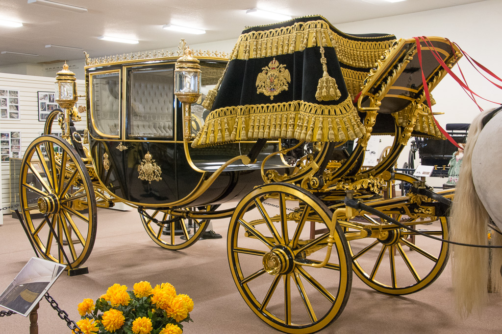 Dress Chariot (Circa 1840-1860) Made by the coachbuilder Armbruster for Emperor Franz Joseph of Austria. Communication with the coachman was via a pull string which attached to a button on the back of his coat. Hammercloth over the driver's seat is of silk velvet, decorated with 210 hand turned, hand covered gold bullions. Over 150 meters of gold cables further adorn the cloth.