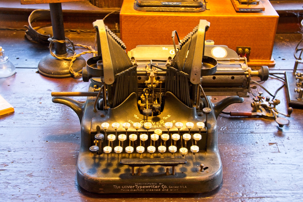 Typewriter typebars came down instead of up. Each typebar had an upper case, lower case and numberic/symbol type.